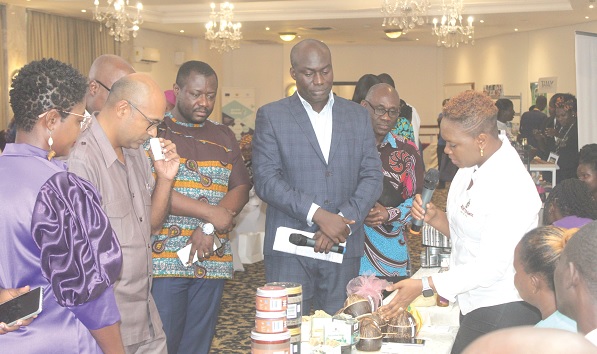Lily Crentsil (right), Sheabutter Boss-Lead, explaining how the product is made to Irchaad Razaaly, (2nd from left), Ambassador of the Delegation of the European Union to Ghana, and some other dignitaries during the  exhibition. Picture: ESTHER ADJORKOR ADJEI