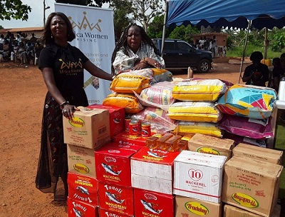 Rev Mrs Nana Sekyere,  founder of AWR and Esther Fife, president of JJM with the items donated
