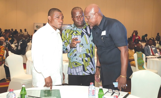 Samuel Abu Jinapor (middle), Minister of Lands and Natural Resources, Ato Afful, MD, GCGL, and George Mireku Duker, Deputy Minister of  Lands, sharing thoughts at the function. Picture: DOUGLAS ANANE-FRIMPONG