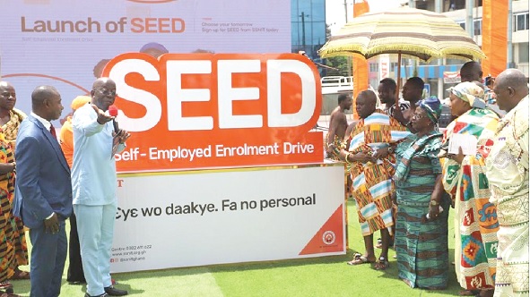 Dr John Ofori-Tenkorang (hand raised) making a remark as he is joined by Nana Osei Kwadwo II (4th from right), the Mamensenhene, to unveil the totem of the SEED launch in Kumasi, while other dignitaries look on. Pictures: EMMANUEL BAAH