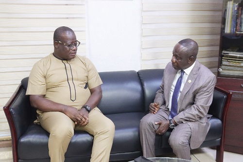 Nana Kwaku Agyei Yeboah (right), Chief Executive Officer, Students Loan Trust Fund, explaining a point to Theophilus Yartey, Editor, Graphic. Picture: ELVIS NII NOI DOWUONA