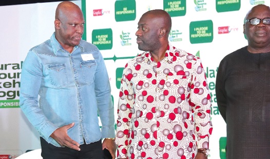 Ato Afful (left), Managing Director, Graphic Communications Group Limited, interacting with Kojo Oppong Nkrumah, Minister of Information, after the GCGL, Natural Resources Stakeholders Dialogue. Picture: ELVIS NII NOI DOWUONA