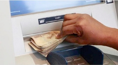 An ATM dispensing money