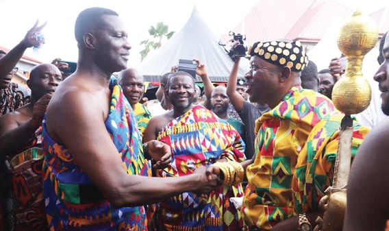  Nana Adusei Atwerewa Ampem I (right), Tepahene, congratulating Dr Yaw Osei Adutwum after his enstoolment as the Nkosuohene of Tepa. Looking on is Eric Nana Agyemang-Prempeh (middle), Director-General, NADMO