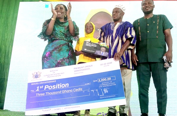 Ursula Owusu-Ekuful (left), Minister of Communications and Digitalisation, applauding after presenting the prize for the overall best girl in ICT to Rahimmah Mohammed from North East Gonja