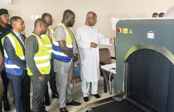 K. T. Hammond (right), Minister of Trade and Industry, inspecting some scanners on the TC-Scan Limited premises at the Kotoka International Airport. Picture: ERNEST KODZI
