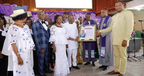 Very Rev. Isaac K. Yeboah (middle), Supt. Minister of Tutuka Circuit of the Methodist Church, with Very Rev. Dr J. Nkyi Asamoh (2nd from right), Principal of Offinso College of Education, and Elijah Adansi Bonah (right), MCE of Obuasi Municipal Assembly, presenting the citation to Ebo Philip Ainoo-Ansah (2nd from left) 