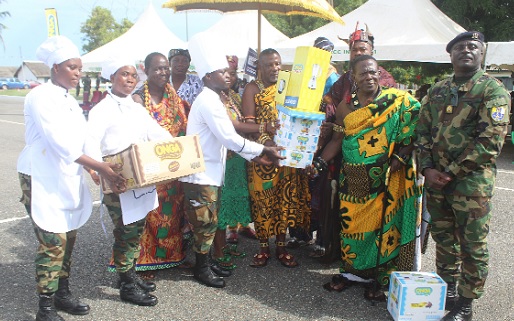 Okatakyei Nana Anim I (2nd from right), " Saanahene" (Royal Treasurer) of Ati New Tafo Akyem, presenting the award to winners of the Ghana Armed Forces Catering Training School cooking competition.  Picture: ESTHER ADJORKOR ADJEI