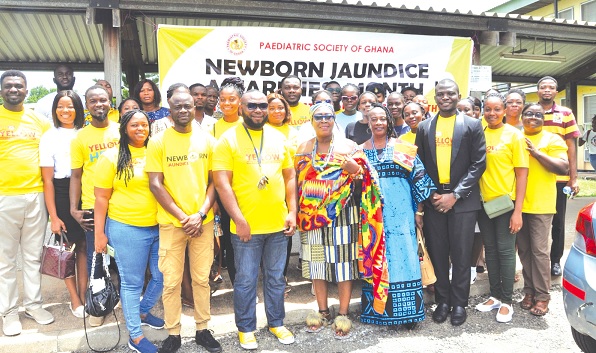 Dr Edem Sarbah (arrowed), Specialist Paediatrician, Mama Afiakumah (5th from right) and some members of the Paediatric Society of Ghana and staff of HTH after the launch