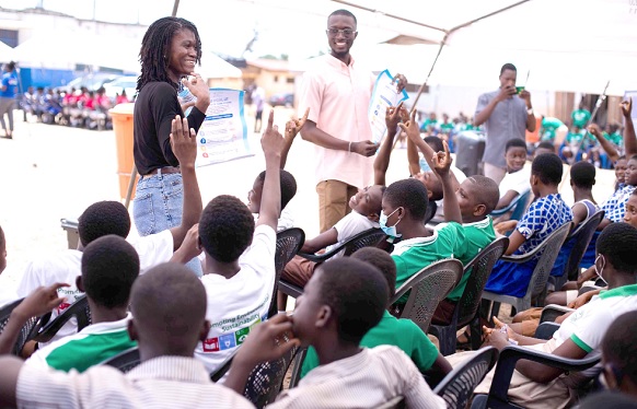 Vivo Energy Ghana volunteers educating school children of La Enobal Basic School on the five steps of hand washing