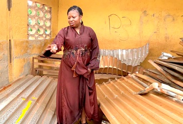 Akanvariba Lydia Lamisi, MP for Tempane, in one of the destroyed facilities