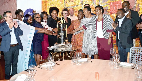 Some members of the leadership of SOAAG joined by industry players including Esther Gyebi-Donkor (3rd from right) to cut the anniversary cake. Picture: DELLA RUSSEL OCLOO