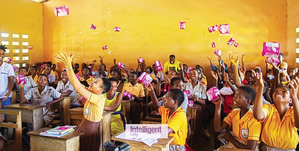 Excited girls at the Obom Kojoman M/A Basic School throw their pads in the air