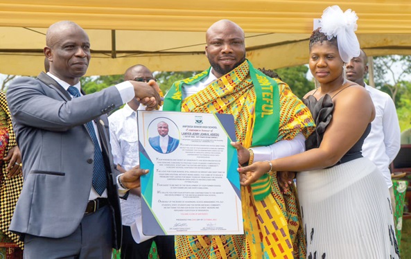Lawyer Jerry John Asiedu (middle) receiving a citation from Albert Kwasi Dodoo (left), the Headmaster of Anfoega Senior High School.   Inset: The new canteen