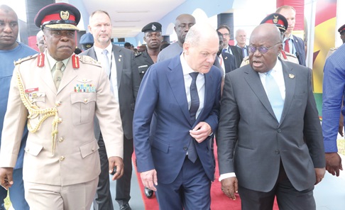 President Akufo-Addo (right) and Olaf Scholz (2nd from left), German Chancellor, conferring after the meeting. With them is Maj. General Richard Addo Gyane (left), Commandant of the KAIPTC. Picture: SAMUEL TEI ADANO 