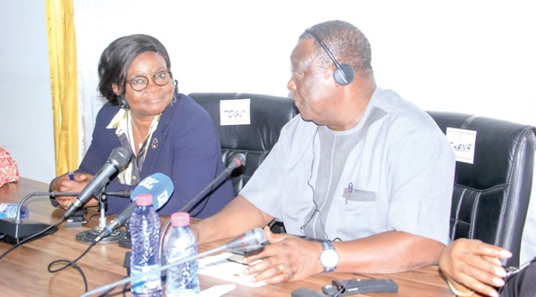 Kwasi Amoako-Attah (right), Minister of Roads and Highways, in a chat with Zourehatou Kassau-Traoe, the Minister of Public Works of Togo, at the inter-ministerial meeting