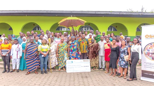 The beneficiaries, staff of the trust fund and other officials after the presentation