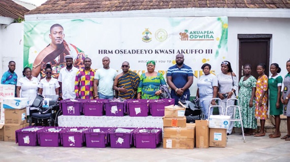 Emmanuel Asa-Ntow (5th from left), Executive Director of OKWAF, Nana Kwabena Mensah (7th from left), the CEO of Alpha Health Group, with representatives of the beneficiary health facilities
