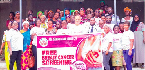 Mohammed Aourongjeb (5th from right), MD, ASA Savings and Loans; Dr Edwin Essel (4th from right), Medical Practitioner, Korle Bu Teaching Hospital; some workers of the ASA Savings and Loans and market women who were examined at the screening exercise at Accra New Town