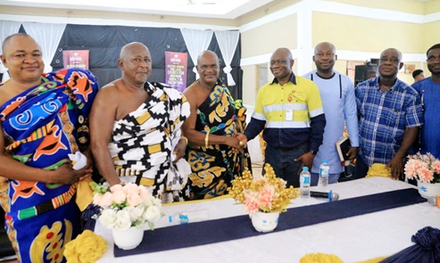 Agya Mensah (3rd from right), MD of Perseus Mining, and Nana Dr Odiamon Ntiri Twum Barimah (3rd from left), Kontehene of Denkyira Traditional Area and Chief of Badoa, with other dignitaries after the community engagement at Denkyira Breman