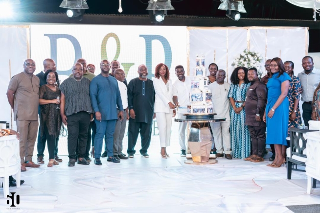 Dignitaries and partners join together to cut the 10th anniversary cake 