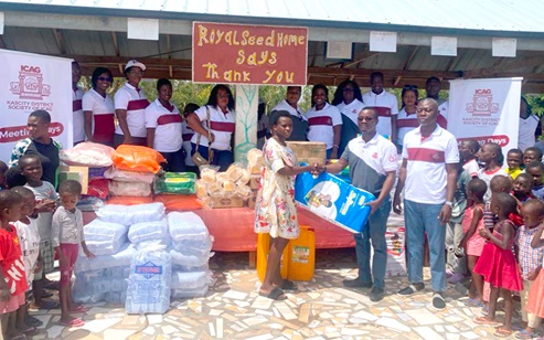 Ken Appiah-Kyeremeh (right), Chairman of the Kascity District Society of the Institute of Chartered Accountants, Ghana, handing over the items to Esther Sakyi, a Senior Caretaker at Royal Seed Home