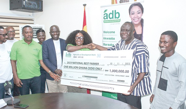  Eno Ofori-Atta (3rd from right), Deputy MD, ADB, presenting the cheque to Frimpong Addo (2nd from right), Deputy Minister of Food and Agriculture. With them are other officials of Mofa and ADB. Picture: ERNEST KODZI
