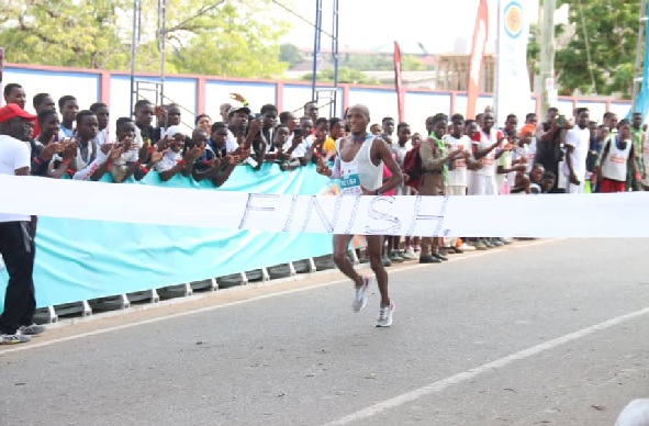 Koogo Atia, winner of the 42.2 km race crossing the finish line. PHOTOS: Elvis Nii Noi Dowuona
