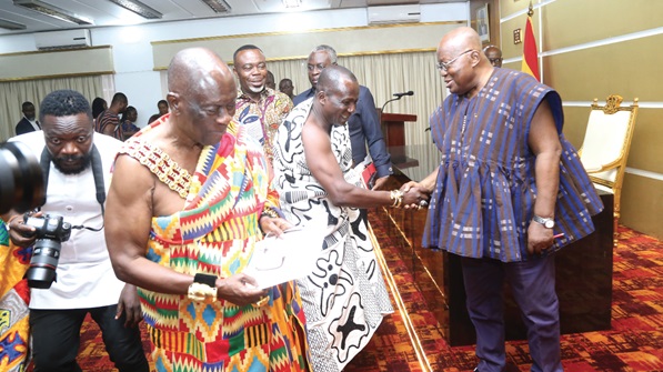 President Akufo-Addo (right) exchanging  pleasantries with some members of the Oti Regional  House of Chiefs  at the Jubilee House