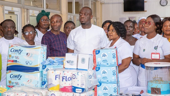 Justin Frimpong Kodua (middle), General Secretary, NPP, presenting the items with some medical staff looking on