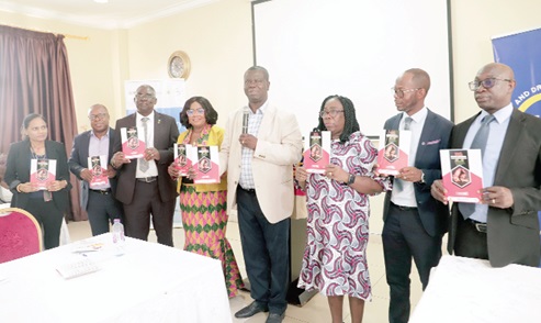 Dr. Baffour-Awuah (4th from right), acting Director, Technical Coordination Directorate, Ministry of Health, Dr. Olivia A. Boateng (4th from left), WHO Focal Point on Tobacco-Ghana and Director, Tobacco and Substance of Abuse Department, Food and Drugs Authority, C/Supt. David Selom Hukportie (3rd from left), Director, Drug Law Enforcement Unit of the CID Headquarters, and other dignitaries launching the National Tobacco Control Strategy. Picture: EDNA SALVO-KOTEY