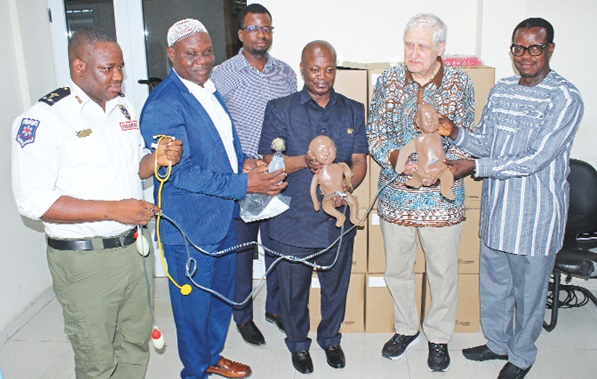 Prof. Anthony Kovac (2nd from right) of the University of Kansas Medical Centre; Prof. Ahmed N. Zakariah (middle), CEO, National Ambulance Service, and other officials holding some of the equipment