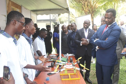 Dr Yaw Osei Adutwum (right), Minister of Education, and Kojo Oppong Nkrumah (2nd from right), Minister of Information, and some guests admiring products by some beneficiaries of STEM.  Picture:  ESTHER ADJORKOR ADJEI