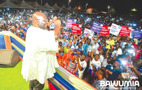Dr Mahamudu Bawumia (left), NPP flag bearer, responding to cheers from the teeming supporters of the party at the rally