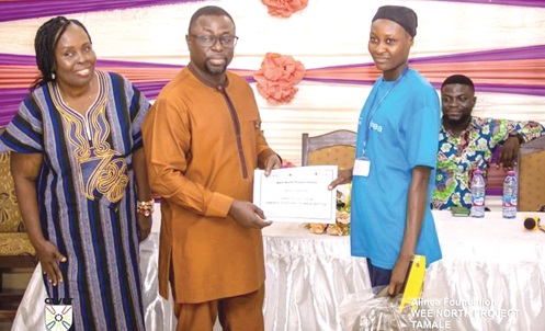 Dr Fred Kyei Asamoah, Director-General of CTVET, presenting a certificate to one of the trainees at Dabokpa Technical Institute under the project