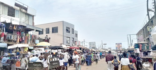 The busy street in front of the Ashaiman Market