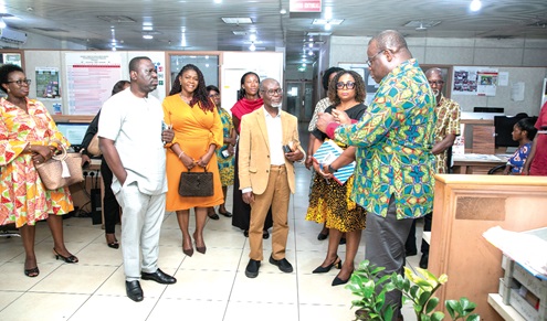 Theophilus Yartey (right), Editor, Graphic, interacting with Kathleen Addy, Chairperson of National Commission for Civic Education,  and her entourage at the Graphic Communications Group Ltd head office in Accra 
