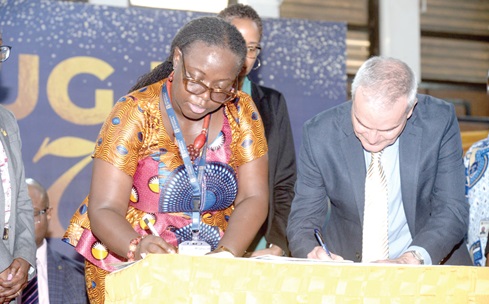 Prof. Nana Aba Appiah Amfo (left), Vice-Chancellor, University of Ghana, and Cave Hills Campus, Principal and Pro Vice-Chancellor, University of West Indies, signing the agreement