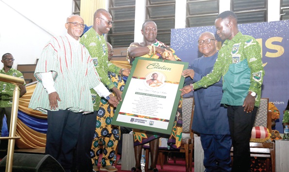 Prof. Aaron Mike Oquaye (2nd from right),  being assisted by Prof. Winfred Gbewonyo (left), presenting a citation to Nana Yaw Sarpong Siriboe (3rd from right), National Best Farmer 2022/2023, at the University of Ghana. Picture: SAMUEL TEI ADANO