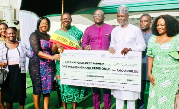 ADB Bank has always been the headline sponsor of the National Farmers Day. FLASHBACK:  Nana Yaw Sarpong Siriboe (3rd from left), 2022 National Best Farmer, Dr Bryan Acheampong (4th from left), Minister of Food and Agriculture, and Alhaji Alhassan Yakubu-Tali (right), Managing Director of ADB, pose with the dummy cheque for the first prize