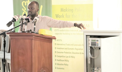 Neville Dodoo-Quartey (inset), Principal Engineer Electrical/ Electronic, Department of Urban Roads, explaining to participants in the meeting how the traffic signal controller works. Picture: EDNA SALVO-KOTEY