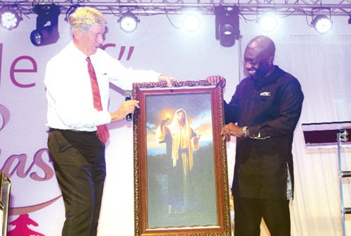 S. Gifford Nielson (left), President of the Africa-West Area, Church of Jesus Christ of Latter-Day Saints, presenting a portrait to Kojo Oppong Nkrumah, Minister of Information.  Picture: ERNEST KODZI