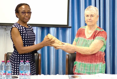 Prof. Janet Neequaye (right) presenting the money to Prof. Christabel N. Laryea, Head, Department of Child Health, KBTH