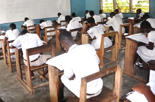 Some students writing an examination