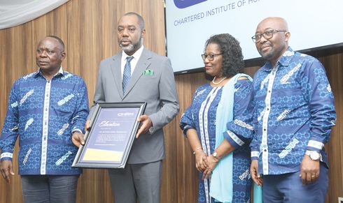 Dr Matthew Opoku Prempeh (2nd from left), Minister of Energy, displaying his citation. With him are Ebenezer Agbottor (right), CEO, CIHRM, Florence Hutchful (2nd from right), Council Member, CIHRM, and Dr Edward Kwapong, President, CIHRM. Picture: SAMUEL TEI ADANO