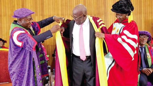 Prof. Richard Kwasi Amankwah (left), Vice-Chancellor of UMaT, and Prof. Rosemond Boohene (right), Pro-Vice-Chancellor, UCC, decorating Sir Sam Jonah, after awarding him with an honorary doctorate degree