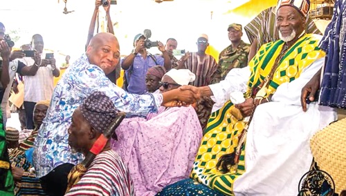 Ya-Na Abukari II (right), the Overlord of Dagbon, in a handshake with Samuel Okudzeto Ablakwa, MP for North Tongu. INSET: The truckload of the Ya- Na's donations
