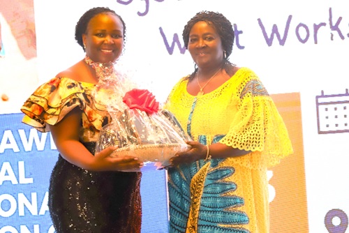 Professor Naana Jane Opoku-Agyemang (right) being presented with the award