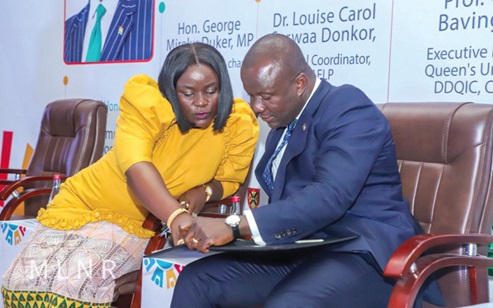 Samuel Abu Jinapor, Minister of Lands and Natural Resources, interacting with Dr Louise Carol Serwaa Donkor, Coordinator of NAELP