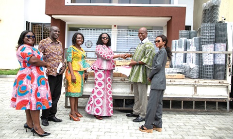 Abena Kumordzi-Agbodemegbe (2nd from right) presenting the items to Lilian Baeka, Chief Director, RCC. With them are Jemimah Lomotey (3rd from left), Regional Economic Planning Director; Prince Newman (2nd from left), Coordinating Director; Yaa Boahemaa Okyere (left), PRO, all of the RCC; and Light Enyo Amedor (right), Deputy Human Resource Manager, Wire Weaving Ind. Ltd